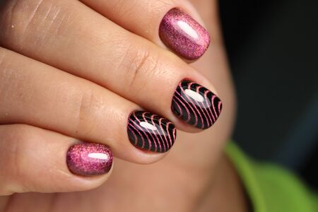 Trendy manicure design on a beautiful textural background.の写真素材
