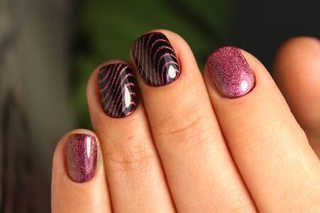 fashion manicure of nails on a beautiful textural backgroundの写真素材