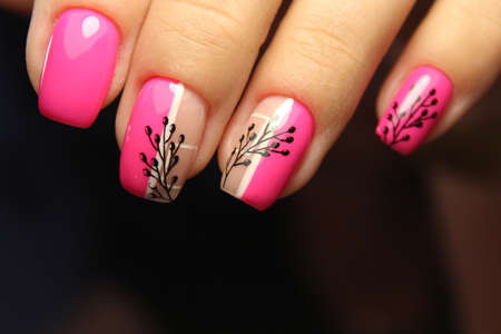 Closeup photo of a beautiful female hands with elegant manicureの写真素材