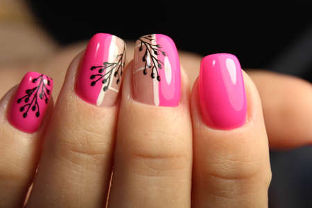 Trendy manicure design on a beautiful background.の写真素材