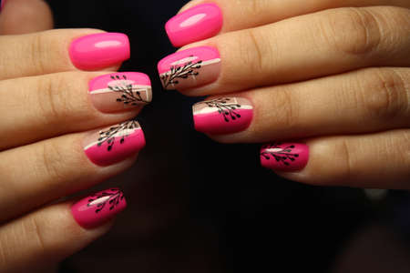 Closeup photo of a beautiful female hands with elegant manicureの写真素材