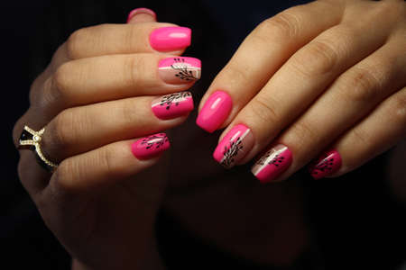 Trendy manicure design on a beautiful background.の写真素材