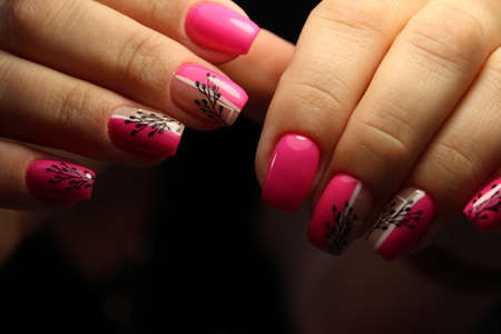 beautiful manicure of nails on the background of a fashionableの写真素材
