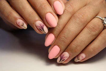 Trendy manicure design on a beautiful background.の写真素材