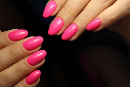 Closeup photo of a beautiful female hands with elegant manicureの写真素材