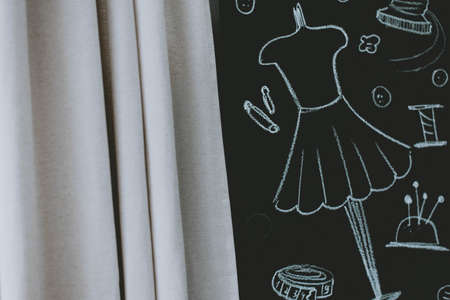 Illustrations about sewing drawn in chalk on a black board. Draw with chalk on a blackboard.の写真素材