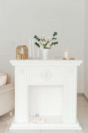 old white vintage table decorated with flowers. interiorの写真素材