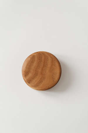 Bottom of a wooden bowl on a white background. A nice little bowl made of wood. Wooden product.の写真素材