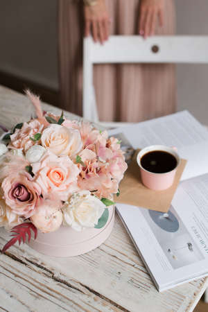 girl drinks coffee at a wooden table. View from above. Wood textureの写真素材
