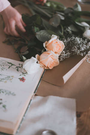 the florist makes a bouquet of fresh flowers. Fresh natural flowers. Florist workの写真素材