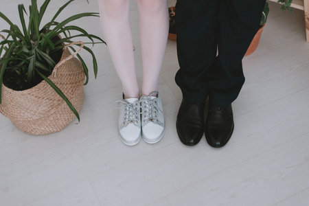 feet in shoes. Legs of a man and a woman. floor