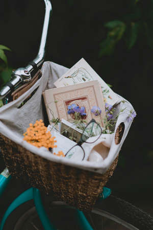 bicycle basket close up. Flowers and postcards. Bike decorationの写真素材