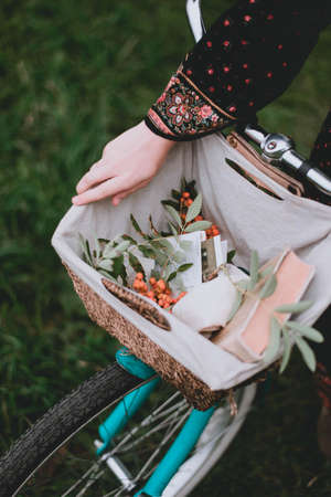 bicycle basket close up. Flowers and postcards. Bike decorationの写真素材