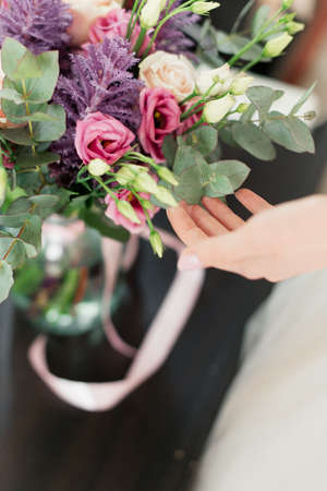 bright bridal bouquet. Bouquet with red and purple flowers.Wedding dayの写真素材