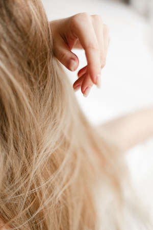 blonde hair and hands close up minimalistic photography abstractionの写真素材