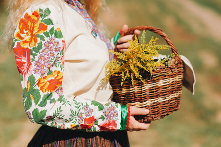 girl in national costume with a basket of flowers close-up National dress