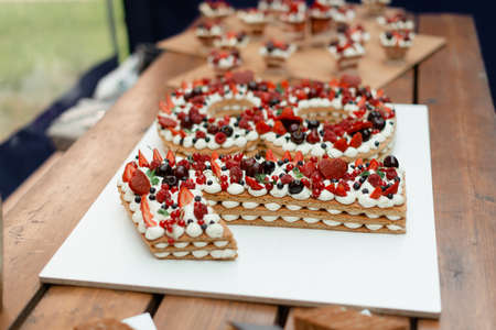 Birthday cake coming of age. Number cake with summer berries.