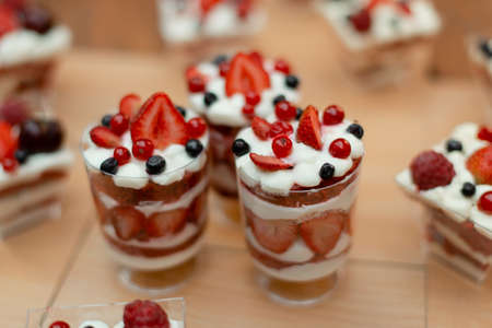 Sweet desserts in cups with wild berries.の写真素材