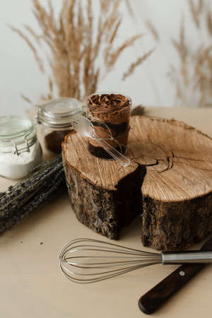sweet chocolate pudding and cutlery on wooden textureの写真素材