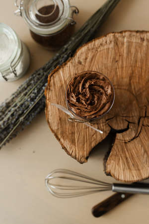 sweet chocolate pudding and cutlery on wooden textureの写真素材