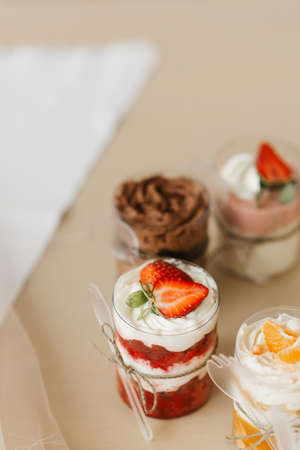 sweet strawberry dessert in a cup close-up on the tableの写真素材