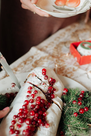 beautiful christmas cake with berries on the table close-upの写真素材