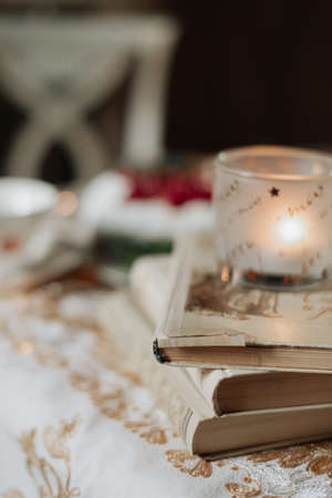 books and a candle lie on the table close-upの写真素材
