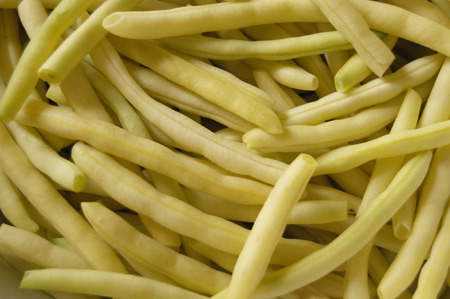 Yellow pods of a string bean cut on piecesの写真素材
