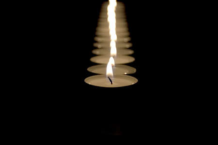 small candles cost on black background inline