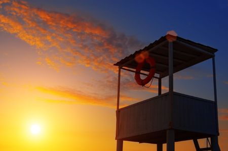 rescue tower and orange sunsetの写真素材