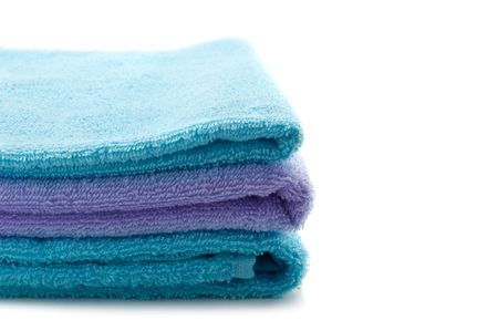 soft blue towel isolated on whiteの写真素材
