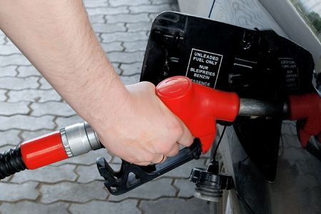 human hand with petrol pump