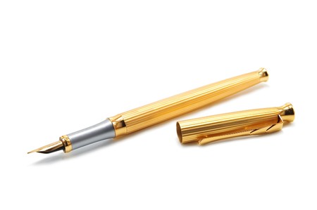golden pen isolated on whiteの写真素材