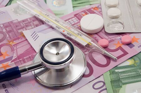 stethoscope and pills on euro noteの写真素材
