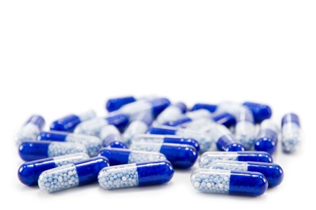 blue pills isolated on white