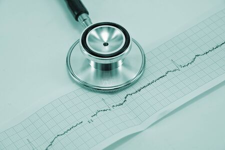 stethoscope and cardiogram close up
