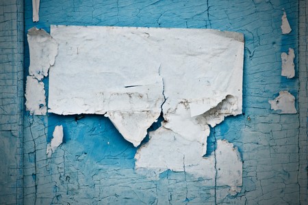 torn paper card on old dorの写真素材