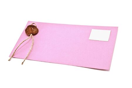 pink enveloope isolated on whiteの写真素材