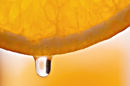 orange juice drop close upの写真素材