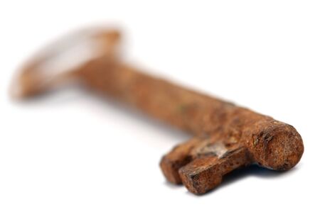 rusty key isolated on whiteの写真素材