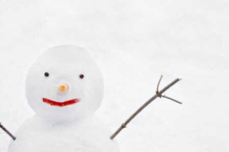 smiling snowman with hand closeupの写真素材