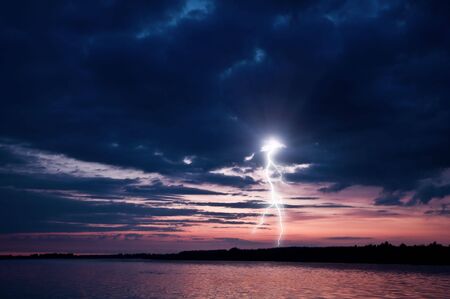 the lightning flash on lake の写真素材