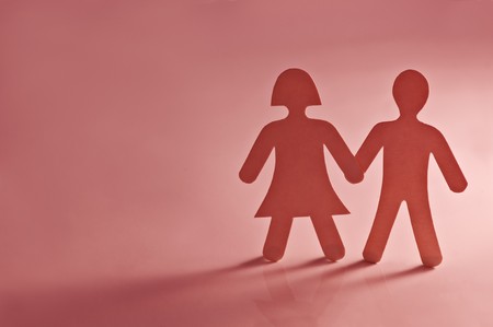 paper couple on pink background closeupの写真素材