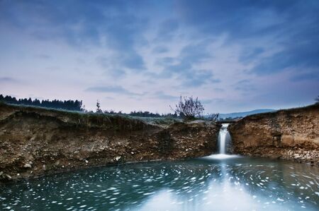 small waterfall on morning timeの写真素材