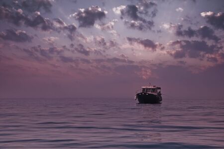 alone boat in tranquil sea