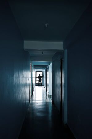 Man silhouette in end of corridorの写真素材