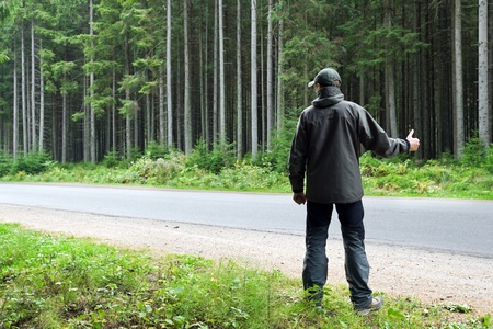 men stopping car on roadsideの写真素材