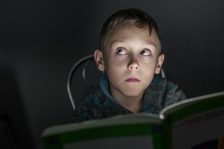 small boy read a bookの写真素材