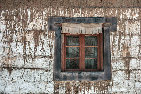 old window on tibetan buildingの写真素材