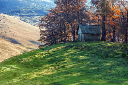 alone house in autumn mountainの写真素材